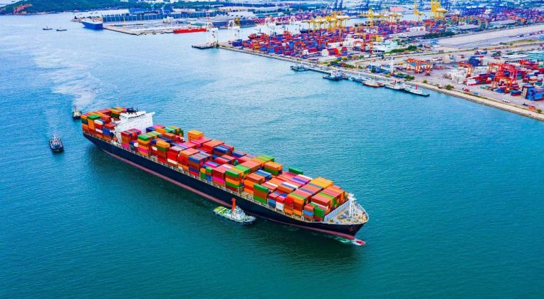 Cargo ships with full container receipts to import and export products worldwide.